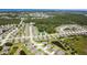 Picturesque aerial view of homes surrounded by natural beauty and tranquil ponds in a community at 267 Talquin Ct, Englewood, FL 34223