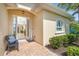 Elegant entryway with welcome sign and a glimpse into the tastefully decorated interior at 267 Talquin Ct, Englewood, FL 34223