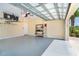 Clean and spacious garage with epoxy flooring and ample storage at 267 Talquin Ct, Englewood, FL 34223