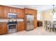 Well-equipped kitchen with stainless steel appliances, granite counters, and a cozy breakfast nook at 267 Talquin Ct, Englewood, FL 34223