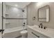 Bathroom with modern black fixtures, white tiled walls, and a bathtub at 271 Antis Dr, Rotonda West, FL 33947