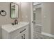 Modern bathroom with sleek vanity, black fixtures, and a stylish mirror at 271 Antis Dr, Rotonda West, FL 33947