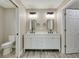 Modern bathroom showcasing a double sink vanity, contemporary mirrors, and sleek fixtures at 271 Antis Dr, Rotonda West, FL 33947