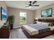 Bedroom featuring wood floors, ceiling fan, and a large window at 271 Antis Dr, Rotonda West, FL 33947