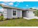 Exterior of home featuring a well-manicured lawn and lush garden at 271 Antis Dr, Rotonda West, FL 33947