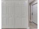 Large set of white hallway closet doors and base trim at 271 Antis Dr, Rotonda West, FL 33947