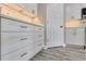 Kitchen cabinetry with gold hardware, backsplash, and wood-style flooring at 271 Antis Dr, Rotonda West, FL 33947