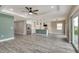 Open-concept kitchen featuring a central island, modern appliances, and sleek countertops at 271 Antis Dr, Rotonda West, FL 33947