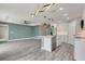 Modern kitchen with an island, pendant lighting, and stainless steel appliances at 271 Antis Dr, Rotonda West, FL 33947