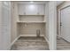 Utility room with wooden-look flooring, white cabinets, marble countertop, and a laundry hookup at 271 Antis Dr, Rotonda West, FL 33947