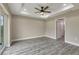 Open living room featuring gray wood-style flooring, recessed lighting, and a ceiling fan at 271 Antis Dr, Rotonda West, FL 33947