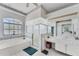 Well-lit bathroom with a large soaking tub, a separate shower, and ample vanity space at 285 Spaniards Rd, Placida, FL 33946