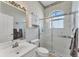 The well-lit bathroom features a shower, a sink and a toilet at 285 Spaniards Rd, Placida, FL 33946