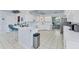 Spacious kitchen with a breakfast bar and all-white appliances at 285 Spaniards Rd, Placida, FL 33946