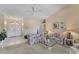 Bright living room with tile floors, high ceilings, floral sofas, and neutral color palette at 285 Spaniards Rd, Placida, FL 33946