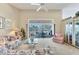 Bright living room boasts soaring ceilings, plush furnishings, and serene pool views through sliding glass doors at 285 Spaniards Rd, Placida, FL 33946