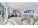 Large, light-filled living room with neutral colors, and picturesque window at 285 Spaniards Rd, Placida, FL 33946