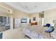 Bright main bedroom with large windows, a ceiling fan, and access to the lanai at 285 Spaniards Rd, Placida, FL 33946