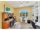 Bright home office space with built-in shelves, desk space, and a large arched window at 285 Spaniards Rd, Placida, FL 33946