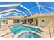 Backyard pool with a screened-in lanai offering stunning backyard views at 285 Spaniards Rd, Placida, FL 33946