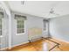 Bedroom with hardwood floors, ceiling fan, and natural light from the windows at 365 Capstan Dr, Placida, FL 33946