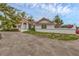 Stunning view of the home's exterior showcasing red tile roof, painted white walls, and stucco perimeter wall at 365 Capstan Dr, Placida, FL 33946