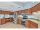 Kitchen featuring stainless steel appliances, a ceiling fan, and tile flooring at 365 Capstan Dr, Placida, FL 33946