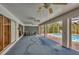 Spacious lanai with multiple ceiling fans, perfect for lounging and enjoying the view of the screened-in pool area at 365 Capstan Dr, Placida, FL 33946
