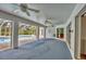 Enclosed patio featuring multiple ceiling fans and access to the pool, offering ample space for relaxation and entertainment at 365 Capstan Dr, Placida, FL 33946