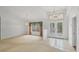 Bright living room featuring an arched window, tiled entry and unique light fixtures at 365 Capstan Dr, Placida, FL 33946