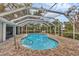 Beautiful screened-in pool with lush surrounding trees, offering a serene and private outdoor space for relaxation at 365 Capstan Dr, Placida, FL 33946