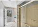 Bathroom featuring a walk-in shower and doorway leading to the screened pool area at 365 Capstan Dr, Placida, FL 33946