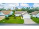 Charming single-story home boasts a well-manicured lawn, lush landscaping, and an inviting entrance at 399 Blue Springs Ct # 203, Englewood, FL 34223