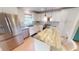 Bright modern kitchen featuring stainless steel appliances, white cabinets, and a center island at 399 Blue Springs Ct # 203, Englewood, FL 34223