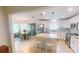 Modern kitchen with white cabinets, stainless steel appliances, and a center island with seating at 399 Blue Springs Ct # 203, Englewood, FL 34223