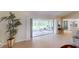 Open living area with access to the screened lanai, offering seamless indoor-outdoor living and entertaining at 399 Blue Springs Ct # 203, Englewood, FL 34223