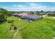 Aerial view of the property featuring a screened pool and beautiful backyard, showcasing its ideal location at 423 Boundary Blvd, Rotonda West, FL 33947