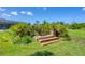 Brick steps in the backyard lead to lush landscaping, adding a touch of charm and natural beauty at 423 Boundary Blvd, Rotonda West, FL 33947