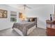 Cozy bedroom featuring neutral tones, plush carpet, and a ceiling fan for added comfort at 423 Boundary Blvd, Rotonda West, FL 33947
