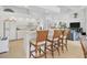 Open kitchen with counter seating and seamless flow into living area at 423 Boundary Blvd, Rotonda West, FL 33947