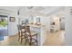 Bright kitchen with tile floors and bar seating, perfect for casual meals at 423 Boundary Blvd, Rotonda West, FL 33947