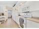 Functional kitchen with white cabinets, appliances, and ample counter space at 423 Boundary Blvd, Rotonda West, FL 33947