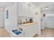 Bright kitchenette area with ample storage, white cabinets, and a view into the laundry room at 423 Boundary Blvd, Rotonda West, FL 33947