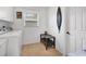 Functional laundry room featuring modern appliances, practical shelving, and natural light at 423 Boundary Blvd, Rotonda West, FL 33947