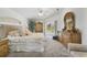 Bedroom with outside views, elegant furnishings, and soft, neutral tones at 423 Boundary Blvd, Rotonda West, FL 33947