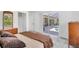 Spacious main bedroom with a comfortable bed and access to the backyard with a pool at 423 Boundary Blvd, Rotonda West, FL 33947