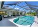 Inviting pool area featuring comfortable seating, a screened enclosure, and ample space for relaxing at 423 Boundary Blvd, Rotonda West, FL 33947