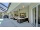 Expansive poolside patio featuring ample seating, a screened-in area, and a view of the sparkling pool at 423 Boundary Blvd, Rotonda West, FL 33947