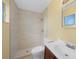 Updated bathroom with modern shower, vanity, and bright natural light at 4371 Tollefson Ave, North Port, FL 34287