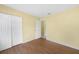 Bedroom featuring hardwood-look floor, closet, and hall entry at 4371 Tollefson Ave, North Port, FL 34287